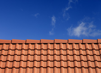 Roof tiles against blue sky