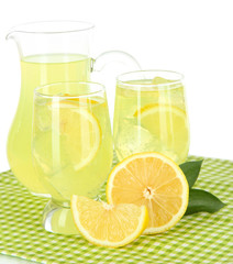Delicious lemonade on table on white background
