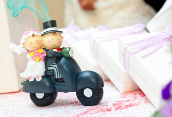 Cake topper 	- Husband and wife on the Vespa