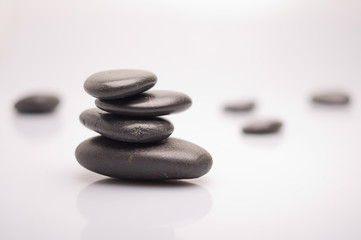 massage stones on white background
