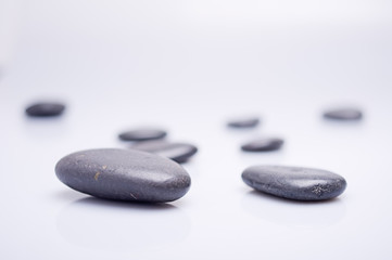 massage stones on white background