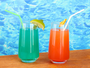 Two cocktails on blue background