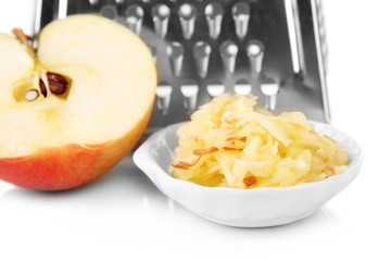 Metal grater and apple, isolated on white