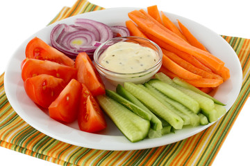 Assorted raw vegetables sticks in plate close up
