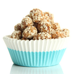 Tasty peanuts with sesame and caramel, isolated on white