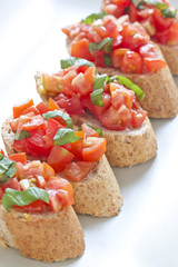 Crostini with tomato, oil, basil and garlic
