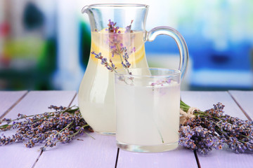 Lavender lemonade, on  violet wooden table, on bright