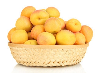 Fresh natural apricot in wicker basket isolated on white