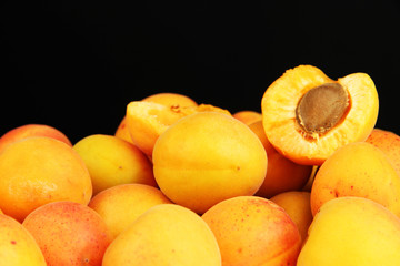 Fresh natural apricot on black background