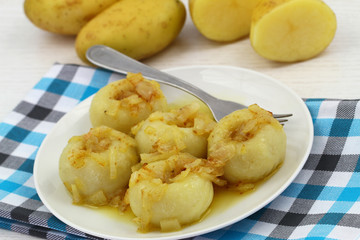 Potato dumplings with fried onions