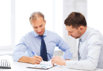 businessmen with notebook on meeting