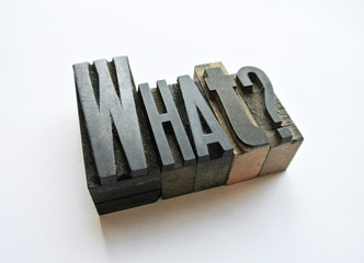 Woodtype letters asking a question what
