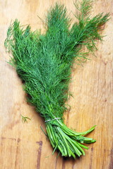 bunch fresh dill herb on wooden table