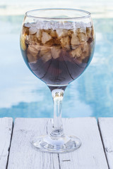 Cola refeshment next to swimming pool