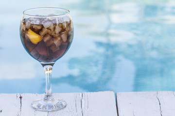 Cola refeshment next to swimming pool