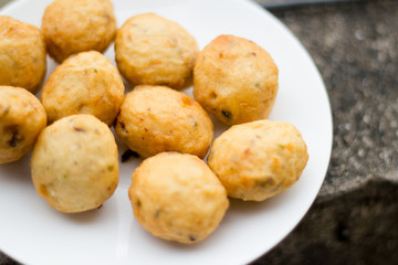 closeup of thai meatballs on white background