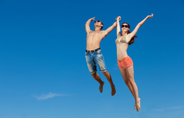 Obraz premium Happy Young Couple Together On The Beach