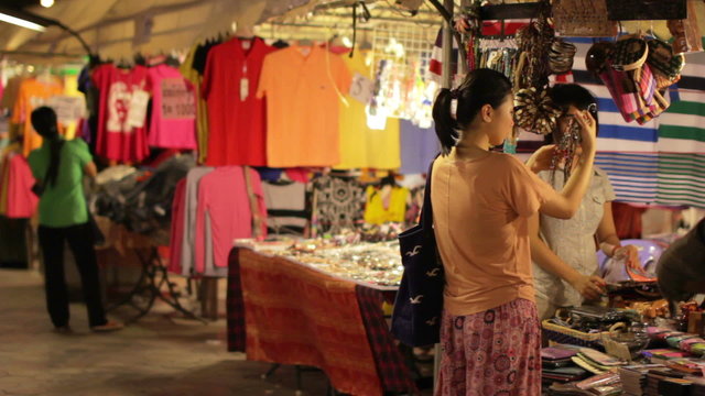 Chinese Young Woman Shopping at asian night market