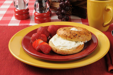 Bagel with cream cheese and strawberries