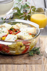 Baked fish with vegetables. Popular mediterranean plate.