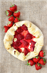 Top view of strawberry galette. Summer pie filled