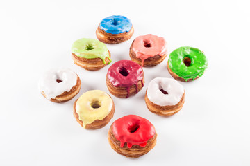 Several colorful fondant croissant and donut mixture
