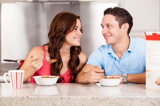 Happy Couple Eating Cereal