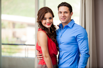 Fototapeta premium Elegant young couple in a bedroom