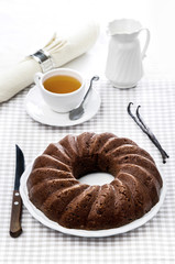chocolate pudding with vanilla sticks and a cup of tea