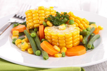 plate of corn and vegetables © M.studio