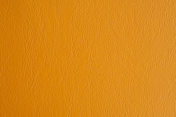 Orange leather texture as background.