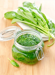 Spinach branch in glass jar