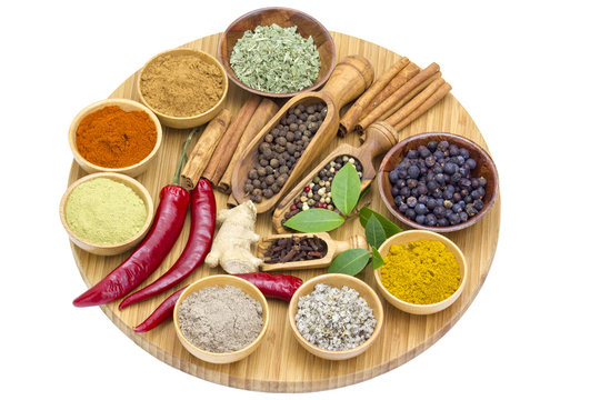 Variety of spices on wooden board
