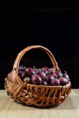 Gooseberries in  a wickerwork plaited basket