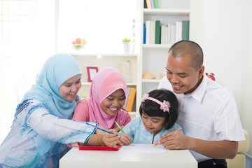  indonesian muslim family learning together with lifestyle backg