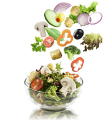 Fototapeta na wymiar Vegetables Falling Into A Salad Bowl