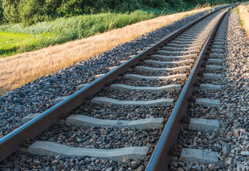 Fototapeta premium Curved railroad in sunlight