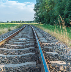 Fototapeta na wymiar Curved railroad tracks