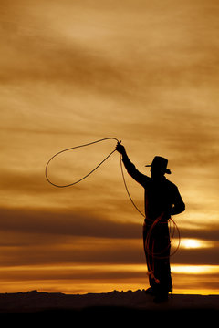 Cowboy silhouette swing rope