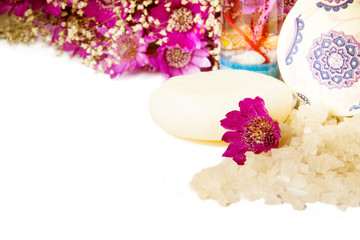 Obraz na płótnie Canvas jar of bath sea salt, soap and violet flowers
