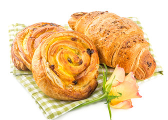 fresh pastry and croissant isolated over white background