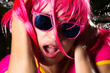 Funny Party Girl with pink hair and glasses. Water Splash
