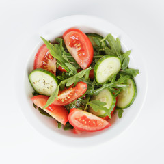 served plate with mix salad from tomatoes and cucumbers