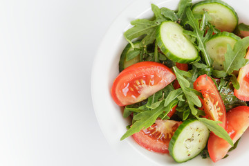 served plate with mix salad from tomatoes and cucumbers