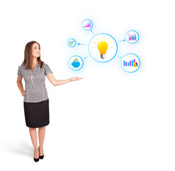 Young woman presenting light bulb with colorful graphs and diagr