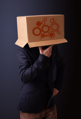 Young man gesturing with a cardboard box on his head with spur w