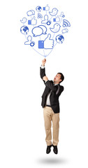 Attractive man holding social icon balloon