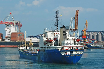 Fototapeta premium General cargo ship and port crane bridge, Odessa, Ukraine