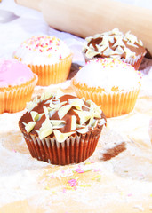 five small cakes with icing
