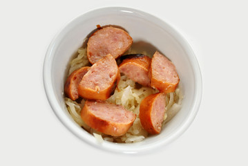 Kielbasa and Sauerkraut in a White Bowl